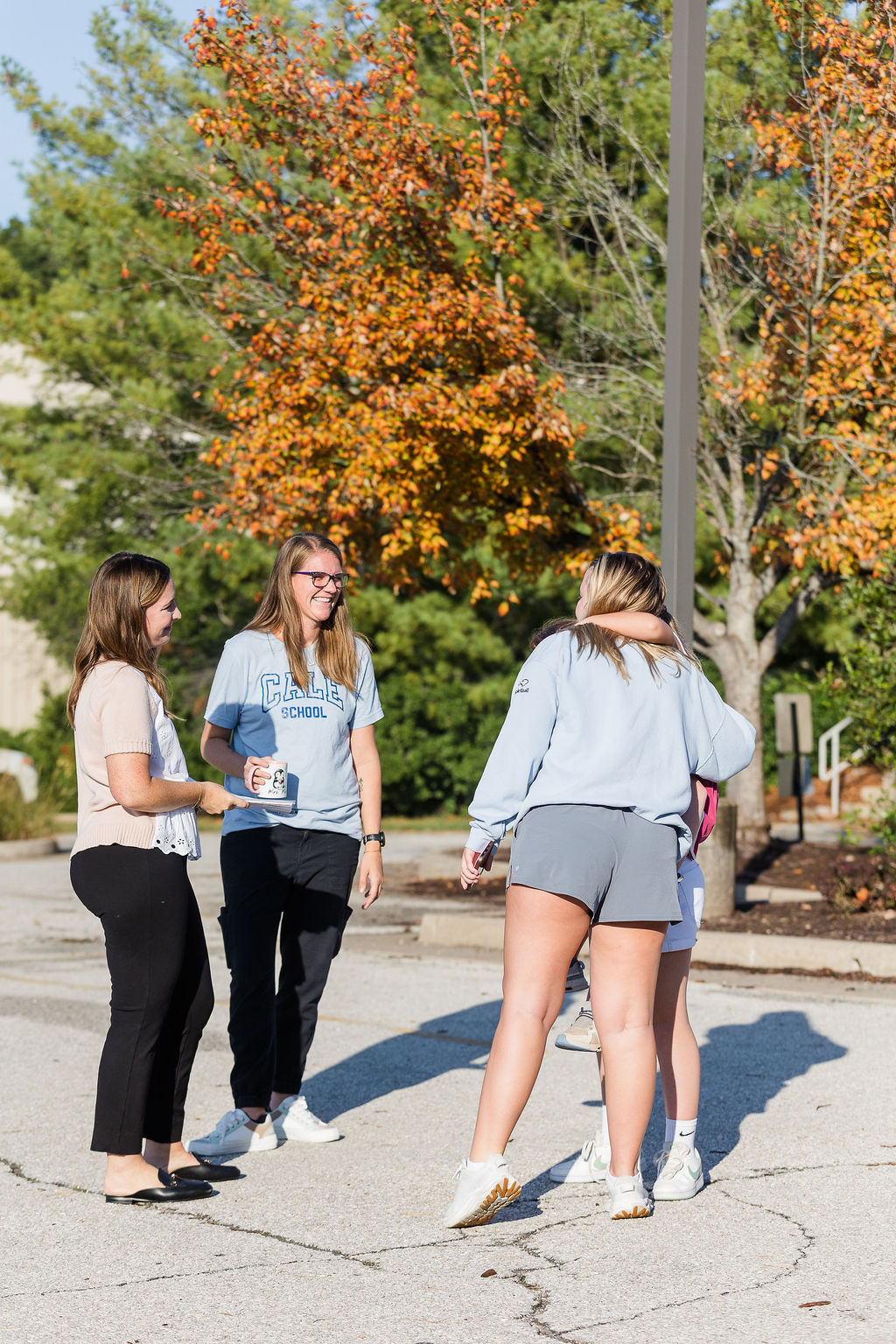 Three teachers chatting during recess