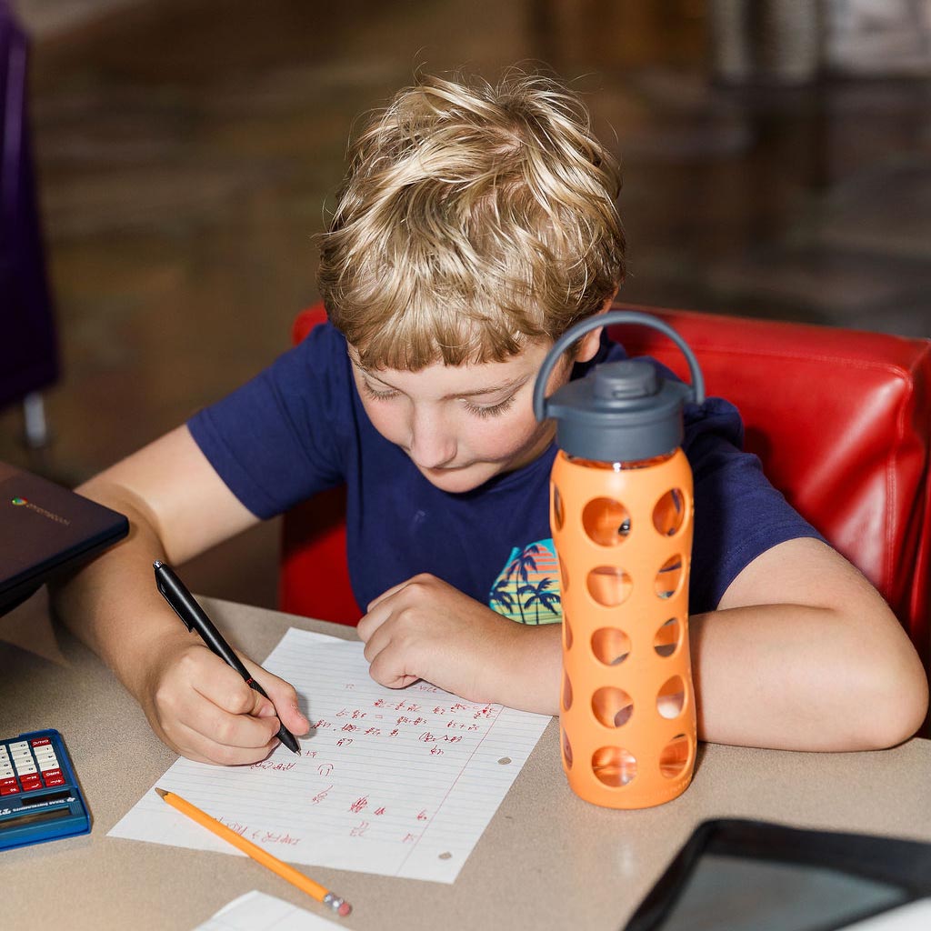 Middle school student focusing on school work
